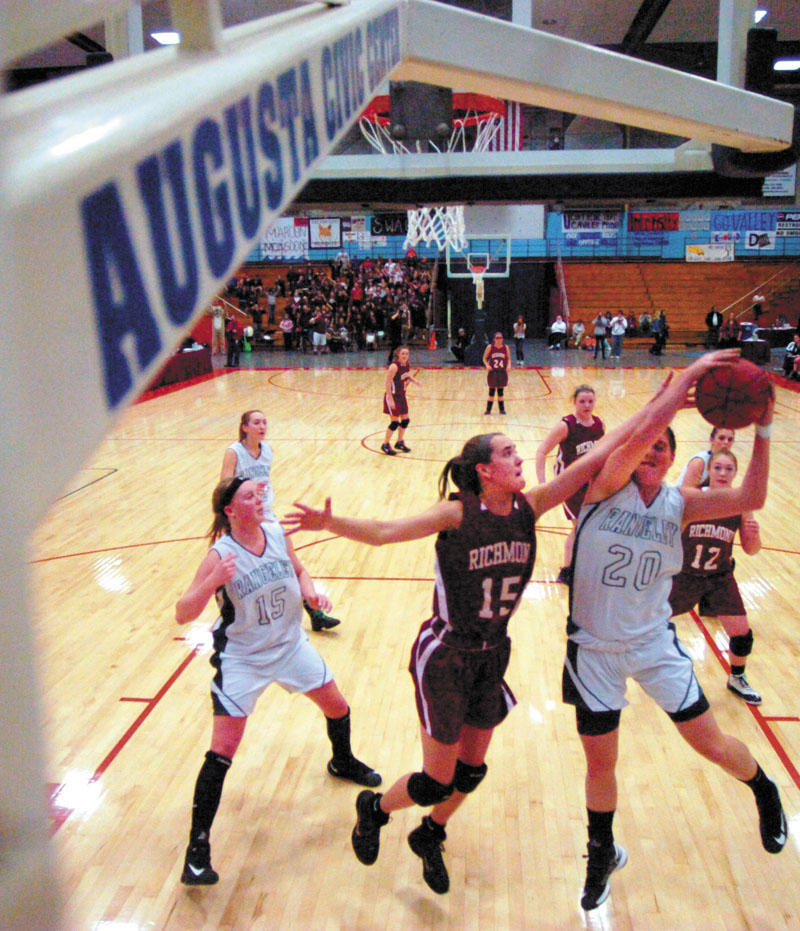 Jamie Plummer, center, and the Richmond girls basketball team faces Washburn in the Class D state title game Saturday at the Bangor Auditorium.