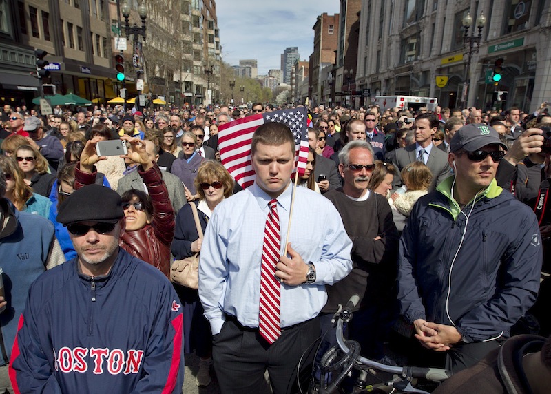 A moment of silence in honor of the victims of the Boston Marathon bombing is observed on Boylston Street near the race finish line, exactly one week after the tragedy, Monday, April 22, 2013, in Boston, Mass. (AP Photo/Robert F. Bukaty)