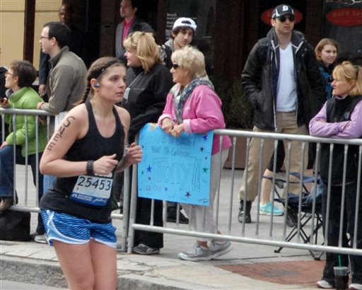 Another photo taken on Monday by Bob Leonard shows, second from right, Tamerlan Tsarnaev, and walking behind him, Dzhokhar A. Tsarnaev.