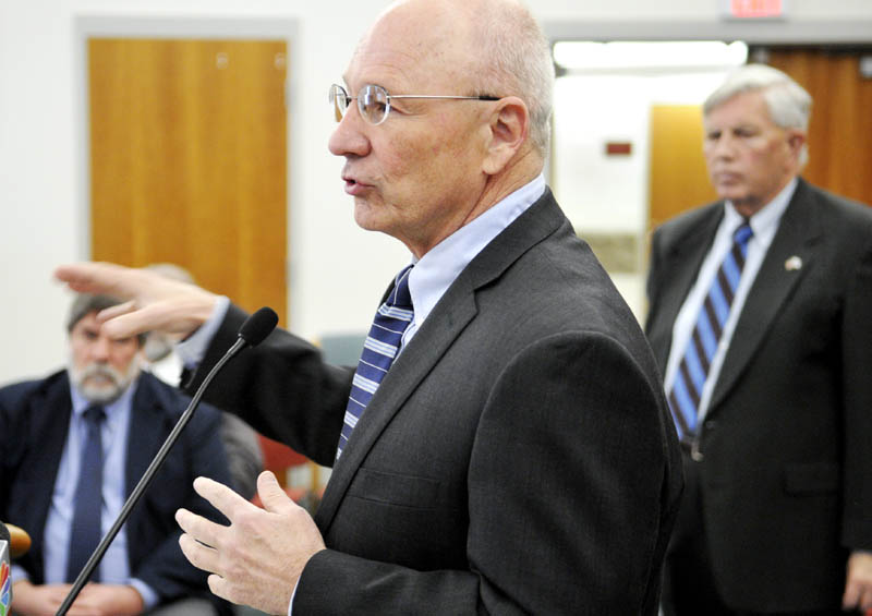 Portland Mayor Michael Brennan, center, discusses a $85 million bond package proposal for Maine cities, during a press conference called by the Mayors' Coalition on Jobs and Economic Development, in Augusta on Monday. At right is Bangor City Council Chair Nelson Durgin and, at left, Gardiner Mayor Thom Harnett.