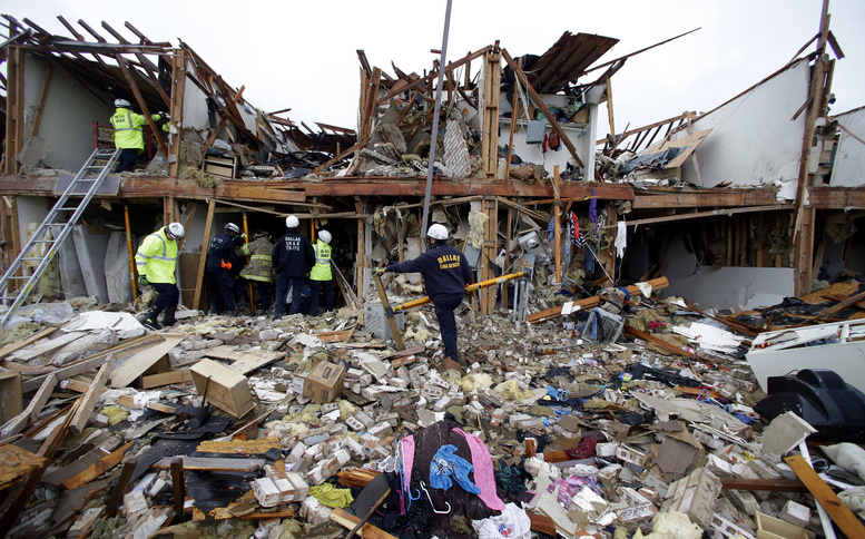 Firefighters search the debris of an apartment complex destroyed by an explosion at a fertilizer plant in West, Texas, on Thursday.