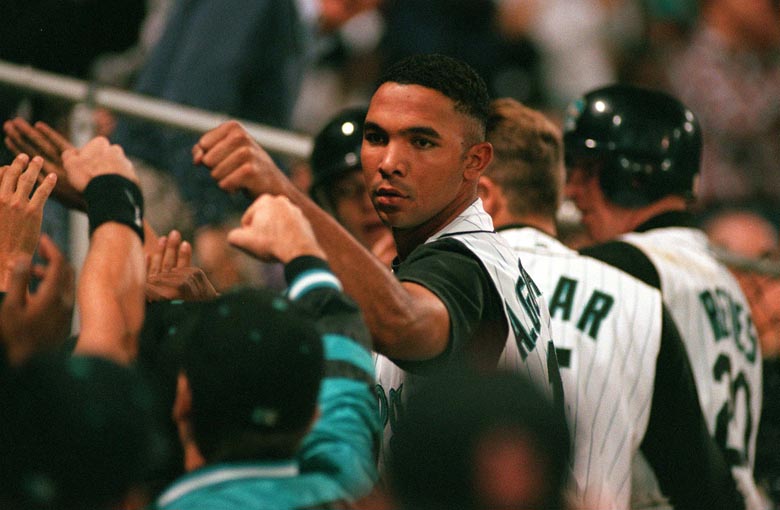 STAFF PHOTO BY MERRY FARNUM -- Saturday, September 6, 1997 -- Sea Dog Alex Gonzalez gives teammates a high five after scoring the third run of the evening to tie the game 3-3 against the Norwich Navigators. Merry Farnum