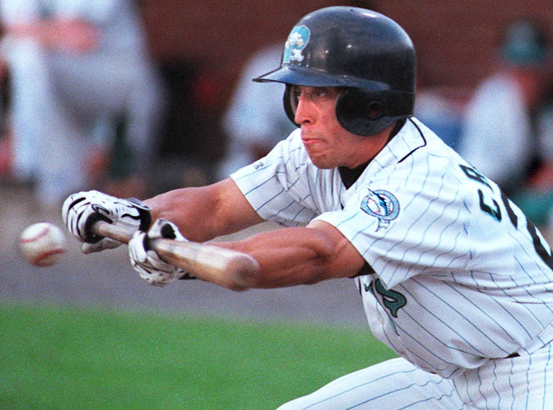 Staff Photo by Gordon Chibroski, Monday, July 10, 2000: Cesar Crespo, Seadog #21, bunts in an early inning and almost gets on by a close call. He was called out. Baseball action vs Norwich Navigators at Hadlock Field. Baseball Cesar Crespo Gordon Chibroski Sea Dogs