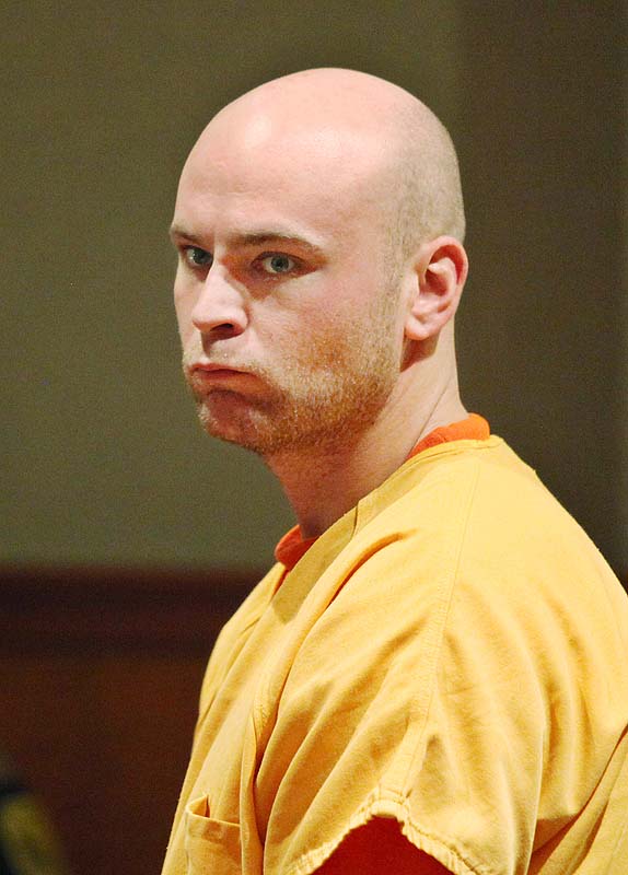 Kyle Upton, who is charged with causing an armed standoff with police in Portland's Bayside neighborhood, looks around the courtroom during his initial court appearance Wednesday at Cumberland County Unified Criminal Court in Portland.