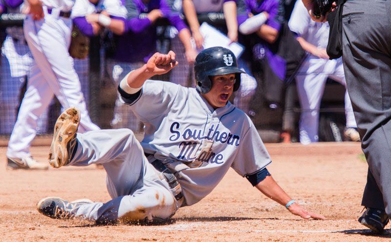 John Carey slides across the plate in the sixth inning Friday, scoring the first run for the University of Southern Maine. The Huskies scored again in the 10th to come away with a 2-1 victory against Millsaps in the opening game of the NCAA Division III national tournament. Division Three Baseball Tournament University of Southern Maine