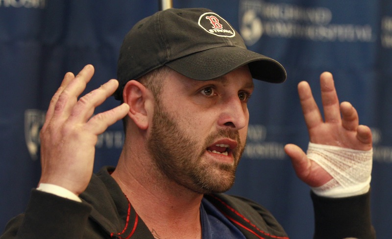 Boston Marathon explosion survivor Jarrod Clowery, of Stoneham, Mass., describes the bombing scene near the finish line of the race during a news conference at Brigham and Women's Hospital in Boston, Mass., Tuesday, April 30, 2013. Clowery suffered severe burn and shrapnel wounds in the bombings that killed three people and wounded more than 260 others. (AP Photo/Charles Krupa)