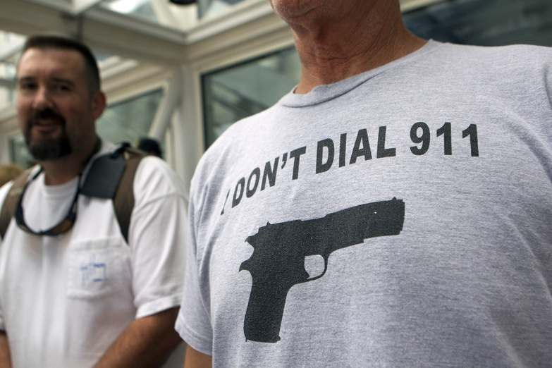John Joseph of Sebastian, Fla., waits in line outside the George R. Brown Convention Center before the opening of the National Rifle Association's 142 annual meeting Thursday in Houston. NRA national Rifle Association set up 142 Annual Meetings and Ex