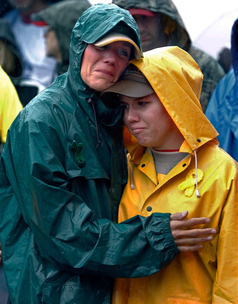 During a moment of silence, Joan Olsen, left, and her daughter Emily Olsen embrace at the start of the Walk for Suicide Awareness in Kaukauna, Wis. on Saturday, Sept. 11, 2010. Joan and Emily are honoring Chris Olsen, who is Joan's husband and Emily's father. The suicide rate among middle-aged Americans climbed a startling 28 percent in the decade between 1999 and 2010, the government reported Thursday, May 2, 2013, but the rates in younger and older people did not change. (AP Photo/Post-Crescent Media, Dan Powers)