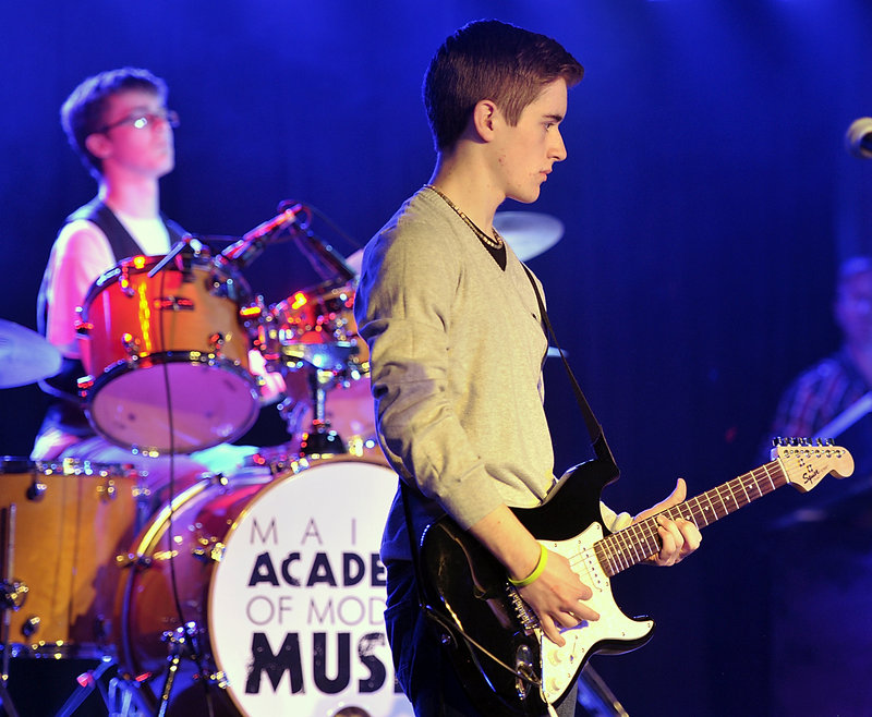 Ben Nason, on drums, and guitarist Eamon Kelley perform with the band Rupture the Fish in the finals of the MAMM Slam teen band competition at the Asylum in Portland.