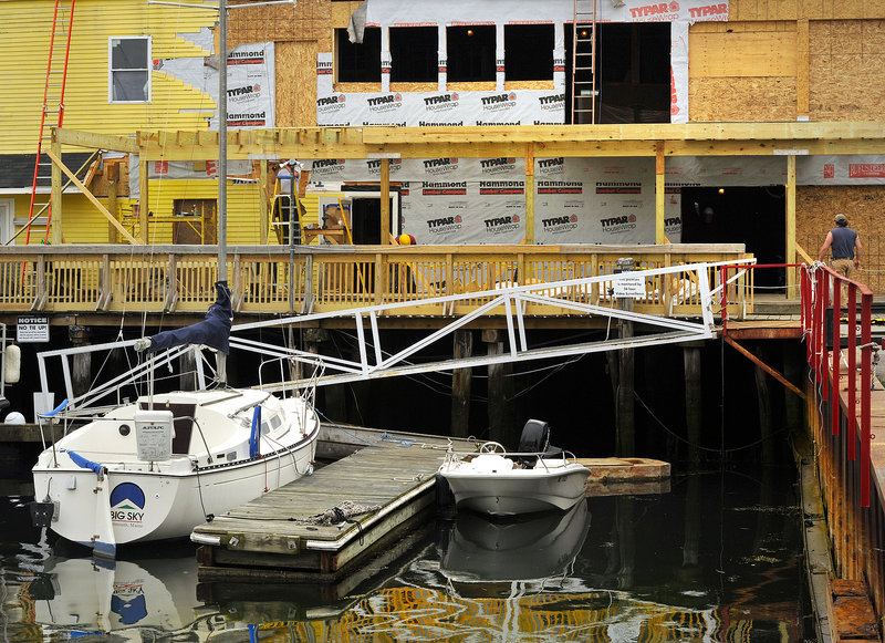 Several of Portland’s waterfront piers are undergoing renovations. The projects include work being done at Boone’s restaurant on Custom House Wharf.