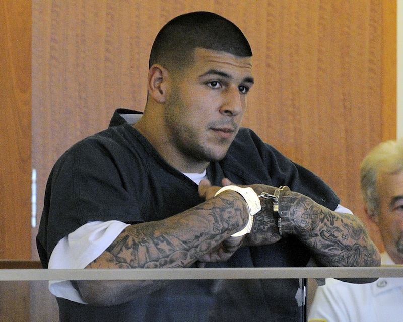 Former New England Patriots football tight end Aaron Hernandez stands during a bail hearing in Fall River Superior Court Thursday, June 27, 2013 in Fall River, Mass. Hernandez, charged with murdering Odin Lloyd, a 27-year-old semi-pro football player, was denied bail. (AP Photo/Boston Herald, Ted Fitzgerald, Pool)