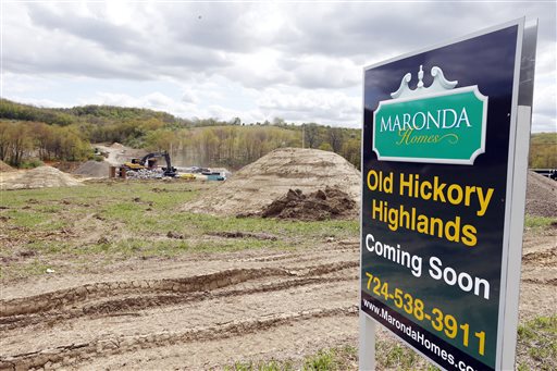 Construction is under way on the infrastructure of a multi-acre housing development in Zelienople, Pa., recently,