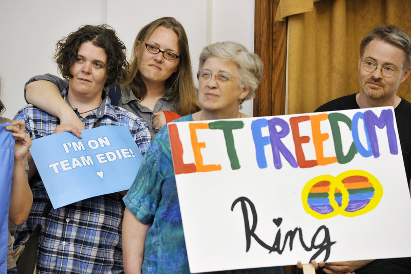 Same-sex supporters gathered at Portland City Hall to celebrate the Supreme Court's decision on Wednesday, June 26, 2013 to give the nation's legally married gay couples equal federal footing with all other married Americans. Supporters (from left) Shannon Tallman, Raminta Moore, Betsy Parsons and Jason Wilkins, all of Portland, listen to speakers at the event.