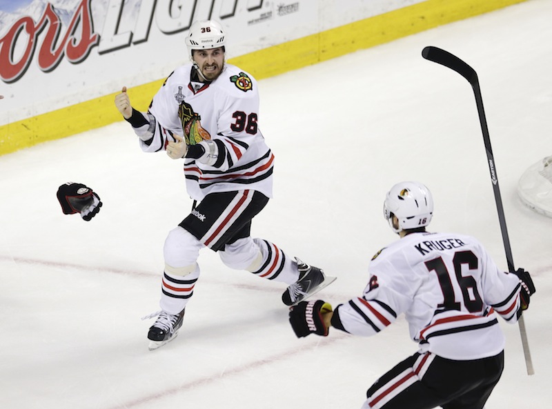 Chicago Blackhawks center Dave Bolland (36) celebrates his game-winning goal against the Boston Bruins with Chicago Blackhawks center Marcus Kruger (16) during the third period in Game 6 of the NHL hockey Stanley Cup Finals, Monday, June 24, 2013, in Boston. The Blackhawks won 3-2. (AP Photo/Charles Krupa) TD Garden