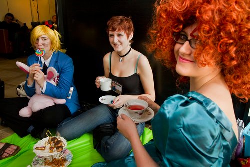 Coryn Armstrong of Cumberland, Sam Dow of Portland and Yuki Hall of Portland have a tea party during the final day of the PortConMaine festival at the Doubletree Hotel in South Portland on Sunday.