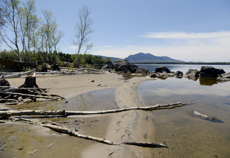 Flagstaff Lake near Eustis, seen here last month with Bigelow Mountain in the background, experiences dramatic changes in water level in summer, thanks to utility drawdowns at a dam on the eastern side of the lake. Residents say the drawdowns adversely affect the quality of life in and around the lake. The Maine Department of Environmental Protection, led by Commissioner Patricia Aho, missed a filing deadline and deprived the state a say in how the dam is regulated. The DEP’s inaction cleared the way for the issuance of a new federal license that lacked stricter water-level rules and will remain in effect until 2036. Aho’s office called the blown deadline an oversight, but internal documents and department insiders tell a very different story.