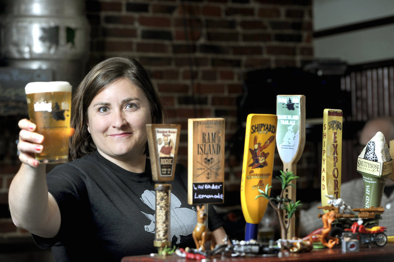 Allison Stevens pours a draft Wednesday at her bar, The Thirsty Pig on Exchange Street in Portland, in advance of the beer celebration known as The Festival. The international event serves as a showcase for the “rock stars” of the craft beer world.