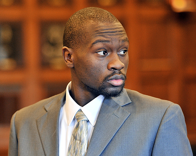 Eric Gwaro, 28, who is accused of elevated aggravated assault and attempted murder, looks to friends in the gallery while attorneys confer with the judge, in this Tuesday photo.