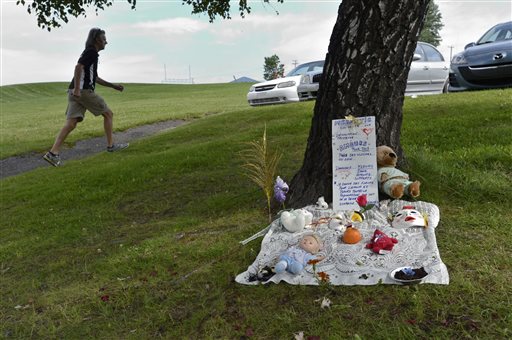 A makeshift memorial for victims of Saturday's oil train derailment and explosions is set up in Lac-Megantic, Quebec, on Wednesday.