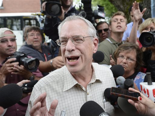 Rail World Inc. President Edward Burkhardt speaks to the media as he tours Lac-Megantic, Quebec, on Wednesday, July 10, 2013. Burkhardt said Wednesday that an employee failed to properly set the brakes of the train that crashed into a town in Quebec, killing 47 people. (AP Photo/ The Canadian Press, Ryan Remiorz)