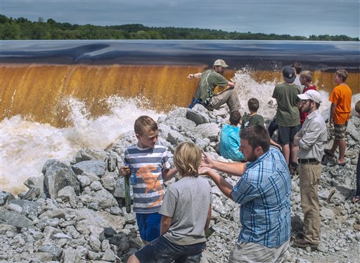 Hundreds of people came to watch the ceremonial breaching of the Veazie Dam in Eddington Monday. Spectators were able to walk alongside the riverbank below the dam. Restoring Atlantic Salmon to the Penobscot River by the breaching of the Veazie Dam has been the collaborative effort of the Penobscot Indian Nation, seven conservation groups and state and federal agencies.