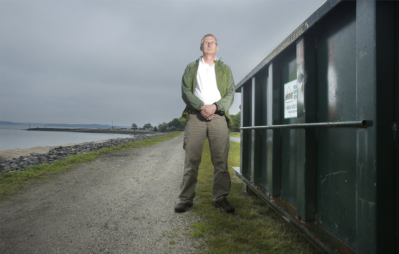 John Littlefield was injured last year when fireworks prematurely exploded during the fireworks show in Portland on July 5. Littlefield was working on a barge, helping to light off the fireworks when the explosion occurred. Littlefield poses on the Eastern Prom on Tuesday, July 2, 2013 next to a dumpster that holds mortar tubes that will be used to set off this year's fireworks.