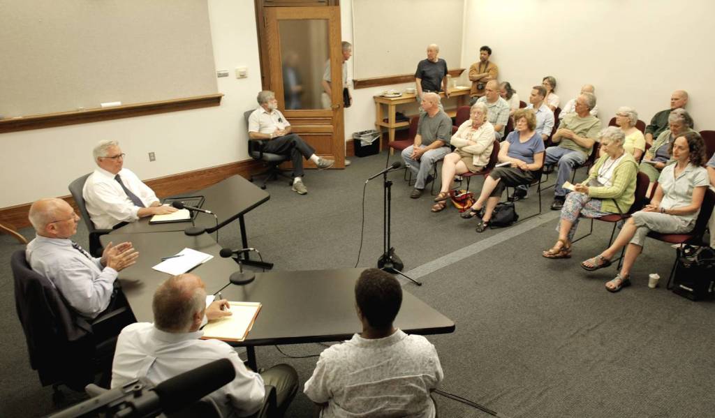 Portland Mayor Michael Brennan, far left, holds a "Meet the Mayor" session at City Hall Thursday evening for residents to bring up issues that concern them.