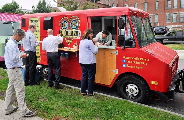 April Garcia takes orders from walk-up customers hungry for authentic Mexican food at the El Corazon food truck in 2014. El Corazon plans to open a bricks-and-mortar restaurant in Portland.