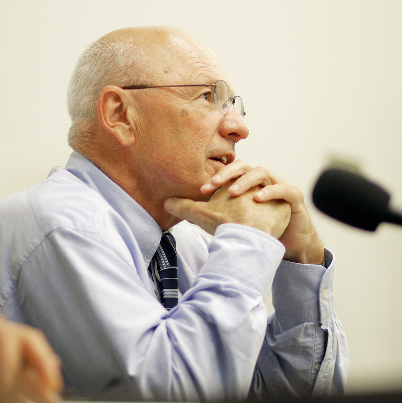 Mayor Michael Brennan contemplates an answer to a question from a resident Thursday.