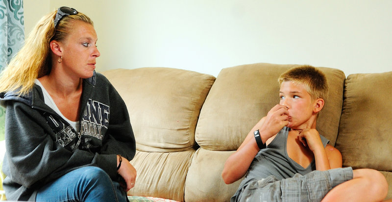 Sandra Watson, left, listens as her son Dylan Young talk about smoking dangerous synthetic drugs that mimic marijuana on Tuesday July 23, 2013 in Augusta. Last spring Young told legislators the story of his bad reaction to Spice, the one time he used it, when he testified in a favor of a bill to ban synthetic drugs.