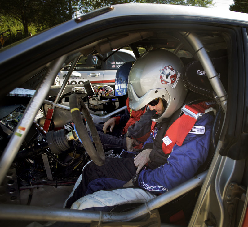 John Cassidy, front, and Dave Getchell, rear, of Last Ditch Racing, settle into their Subaru rally car before departing for the first stage of the day at the New England Forest Rally.