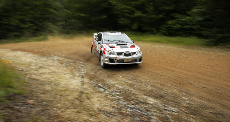 The Last Ditch Racing team of John Cassidy and Dave Getchell work their Subaru through the Concord Pond Stage of the 2013 New England Forest Rally in Newry on Friday. Driving competitively on loose surfaces is a dance performed at the edge of control.