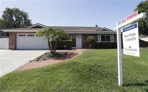 A sign reads "sale pending" in front of this home in San Diego recently. The National Association of Realtors says existing home sales have risen 17.2 percent over the past 12 months.