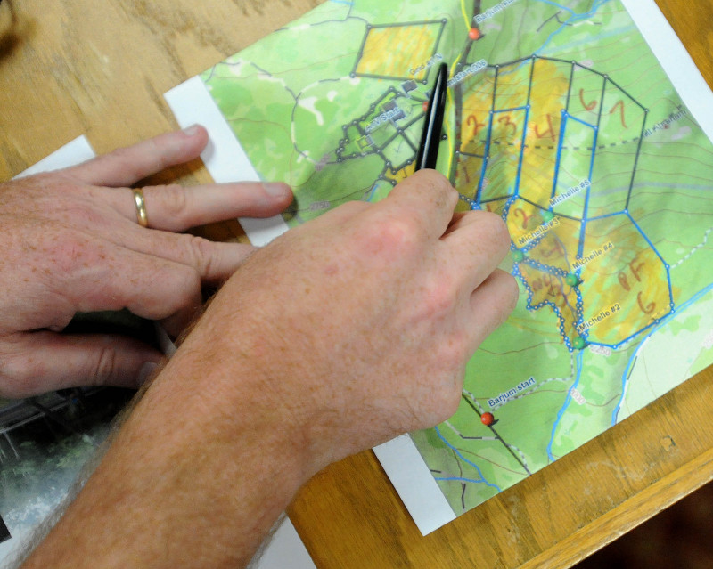 Lt. Kevin Adam, with the Maine Warden Service, points to a map to illustrate to reporters where searches are taking place to find missing Appalachian Trail thru-hiker Geraldine Largay, 66, at the Sugarloaf Mountain Hotel conference center in Carrabassett Valley today.