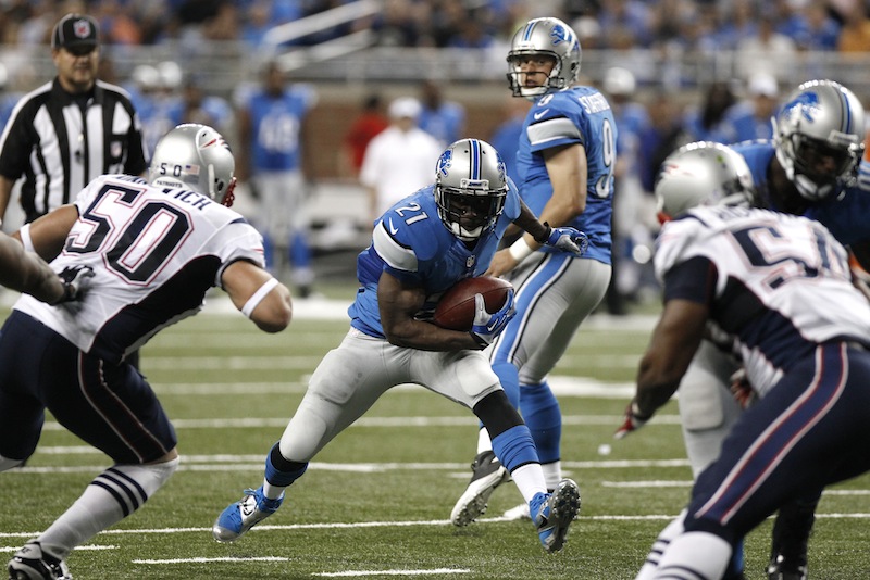 Detroit running back Reggie Bush looks for running room against the New England Patriots on Thursday.