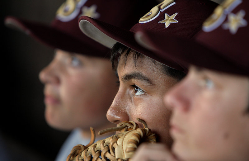 Anthony Bracamonte listens to head coach Todd Duchaine at the end of practice for the Saco Little League team Wednesday evening. The club, which won the state title over Portland Bayside, has already departed for Bristol, Conn., to compete this weekend in the New England Regional Championship.