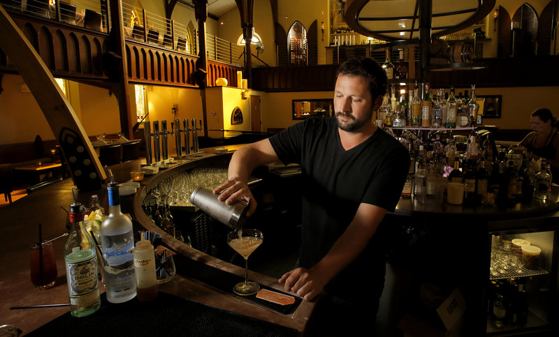 Luke O'Neill, bartender at Grace Restaurant, makes a Champagne shrub cocktail that contains Champagne grapes, Champagne vinegar, Dolin Blanc vermouth, Grey Goose vodka, and a Cabernet Sekt (an Austrian sparkling wine) float.