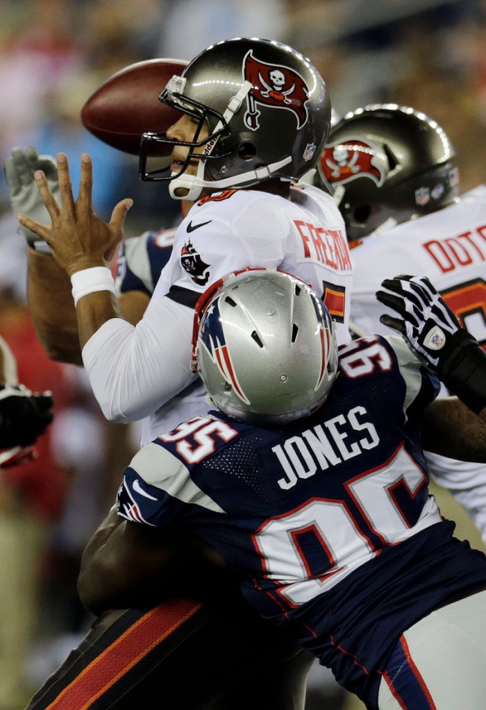 It’s a rough night for Tampa Bay quarterback Josh Freeman, who was sacked three times, including this one by defensive end Chandler Jones.