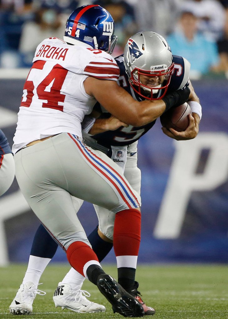 New York defensive end Matt Broha sacks New England quarterback Tim Tebow during the third quarter of Thursday’s game at Gillette Stadium.