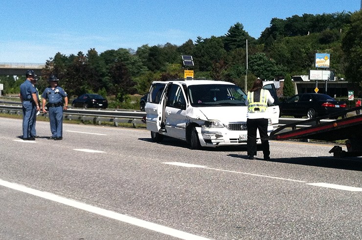Maine State Police stand by as a vehicle is towed from the crash scene on Interstate 295 southbound near Tukey's Bridge on Friday.