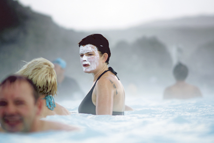 The water in the Blue Lagoon is rich in minerals like sulfa and silica. Many people like to smear silica mud on their faces while bathing.
