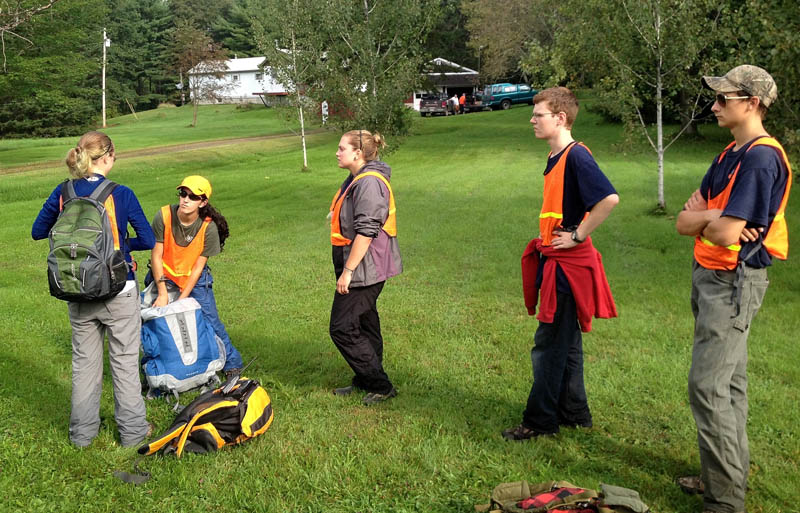 Members of Dirigo and Unity College search and rescue teams get ready to search behind the residence of Arthur Wakeman, 86, at his home at 344 East Benton Road in Benton on Thursday. Game wardens are searching for Wakeman who has been missing since Wednesday.