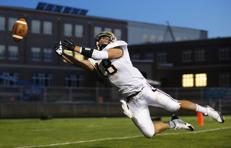 Cody Lynn of Thornton Academy dives for a pass that falls just out of reach Friday night during the Western Class A opener against South Portland. Thornton, the defending state champion, suffered a 26-13 setback.