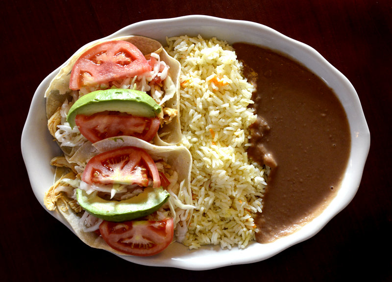 The Enchilada Salvadorena at Tu Casa in Portland includes corn tortillas with chicken, rice and beans and fresh vegetables.