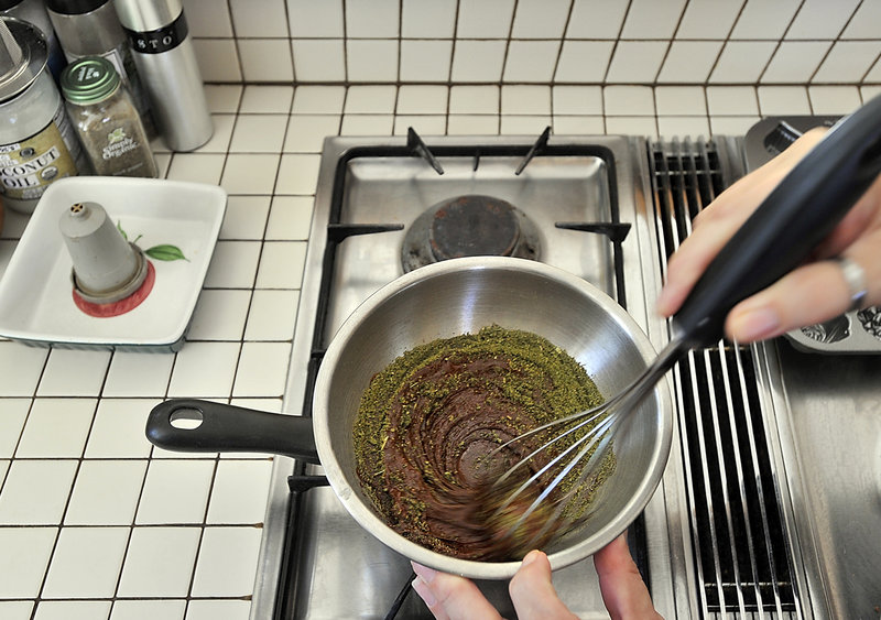 Frank and Michele show how their business of providing marijuana and byproducts to their legally approved patients works. Here, Michele mixes powdered cannabis with fine chocolate to make chocolate candies.