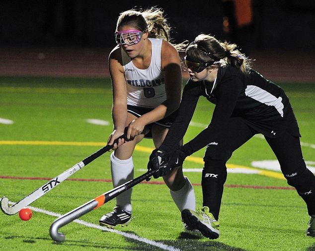 Alexandra Jones, left, of York battles with Spruce Mountain’s Elizabeth Chretien. York will play Nokomis for the state title Saturday at Yarmouth High.