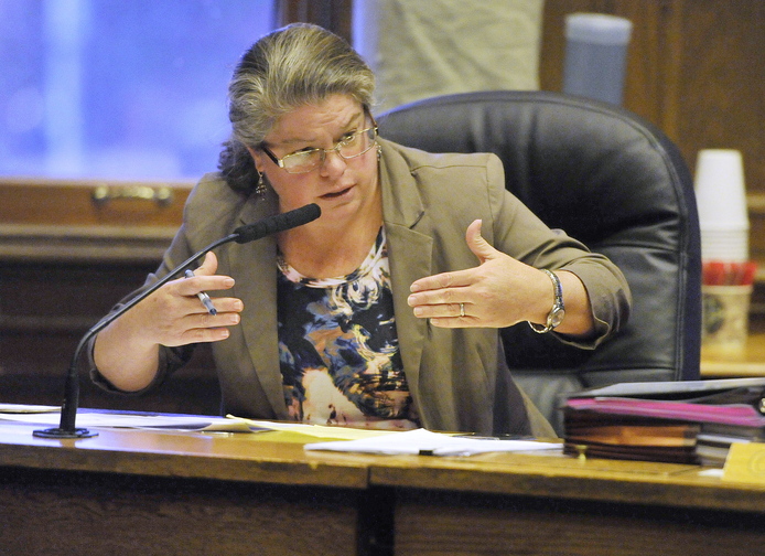 John Ewing/staff photographer... Trisha McAllister, chairwoman of Portland’s Public Safety, Health and Human Services Committee, gives her findings to City Council members before the public hearing Tuesday.