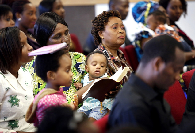 International Christian Fellowship members worship at their new location. Many immigrants find refuge and community at the church.