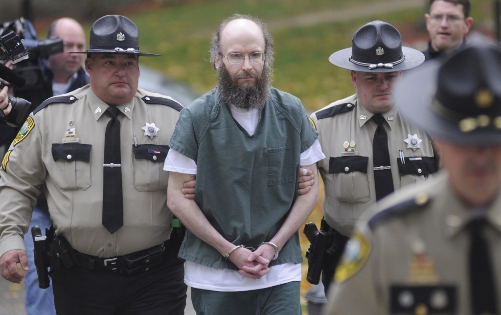 Christopher Knight is escorted into Kennebec County Superior Court in Augusta on Monday to enter pleas for multiple burglaries and thefts while living in the woods of central Maine for 27 years. The North Pond Hermit agreed to plead guilty in exchange for receiving an alternative sentence with the Co-Occurring Disorders Court, a special, intensive supervision program where he will live and work in the community while reporting weekly to a judge.