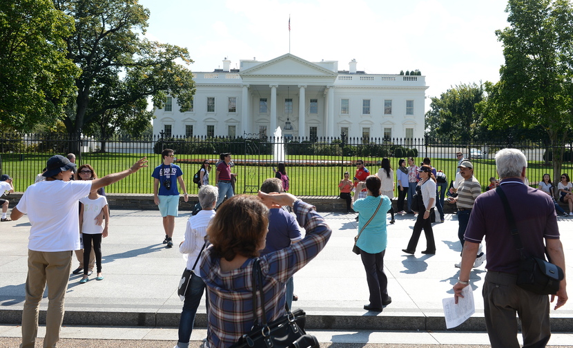 Despite the federal government shutdown that went into effect at midnight Monday, a few tourists still came to Pennsylvania Avenue in Washington to look at the White House on Tuesday.